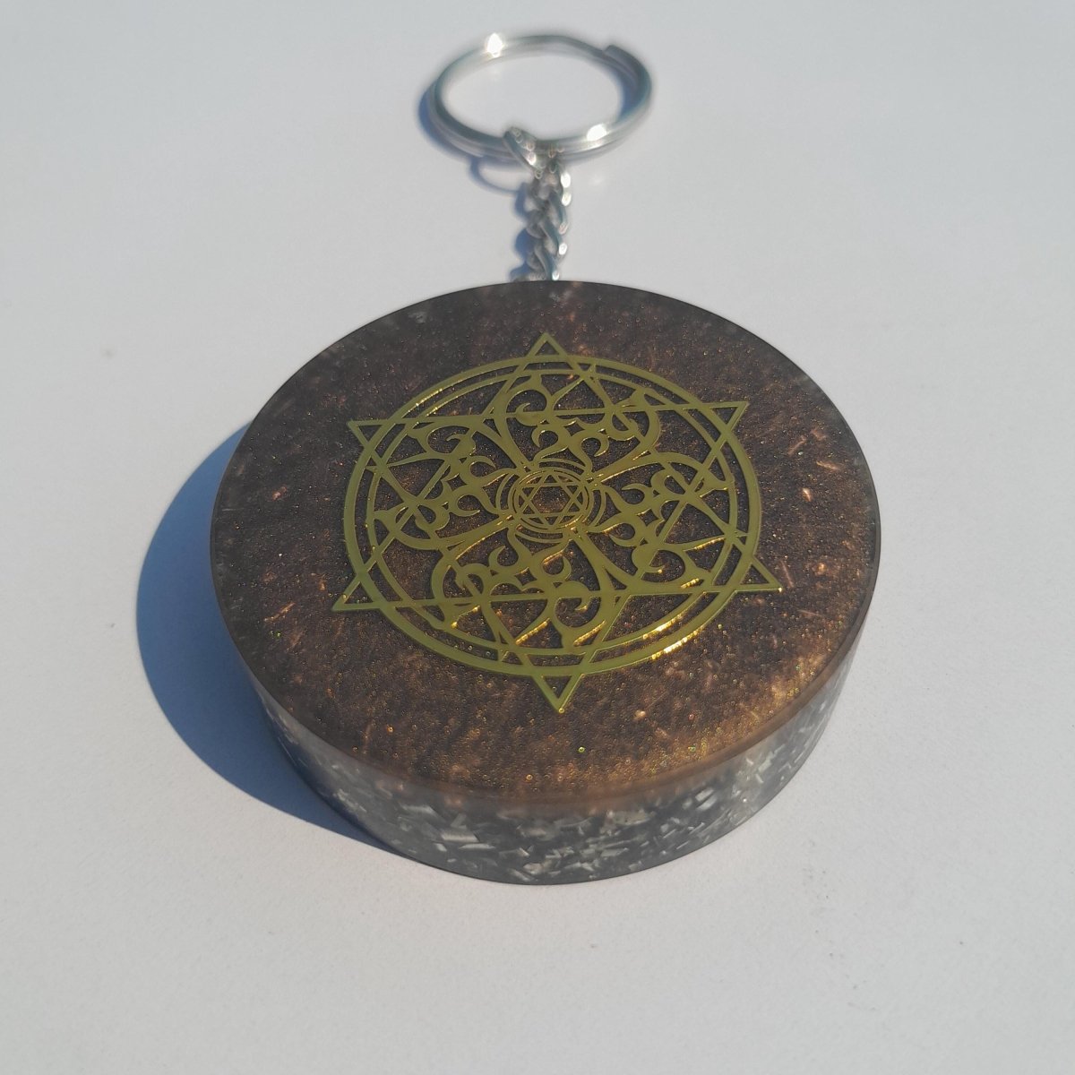 Llavero Orgonita Estrella de 6 Puntas Marrón con Shunguita - Mundo Orgon