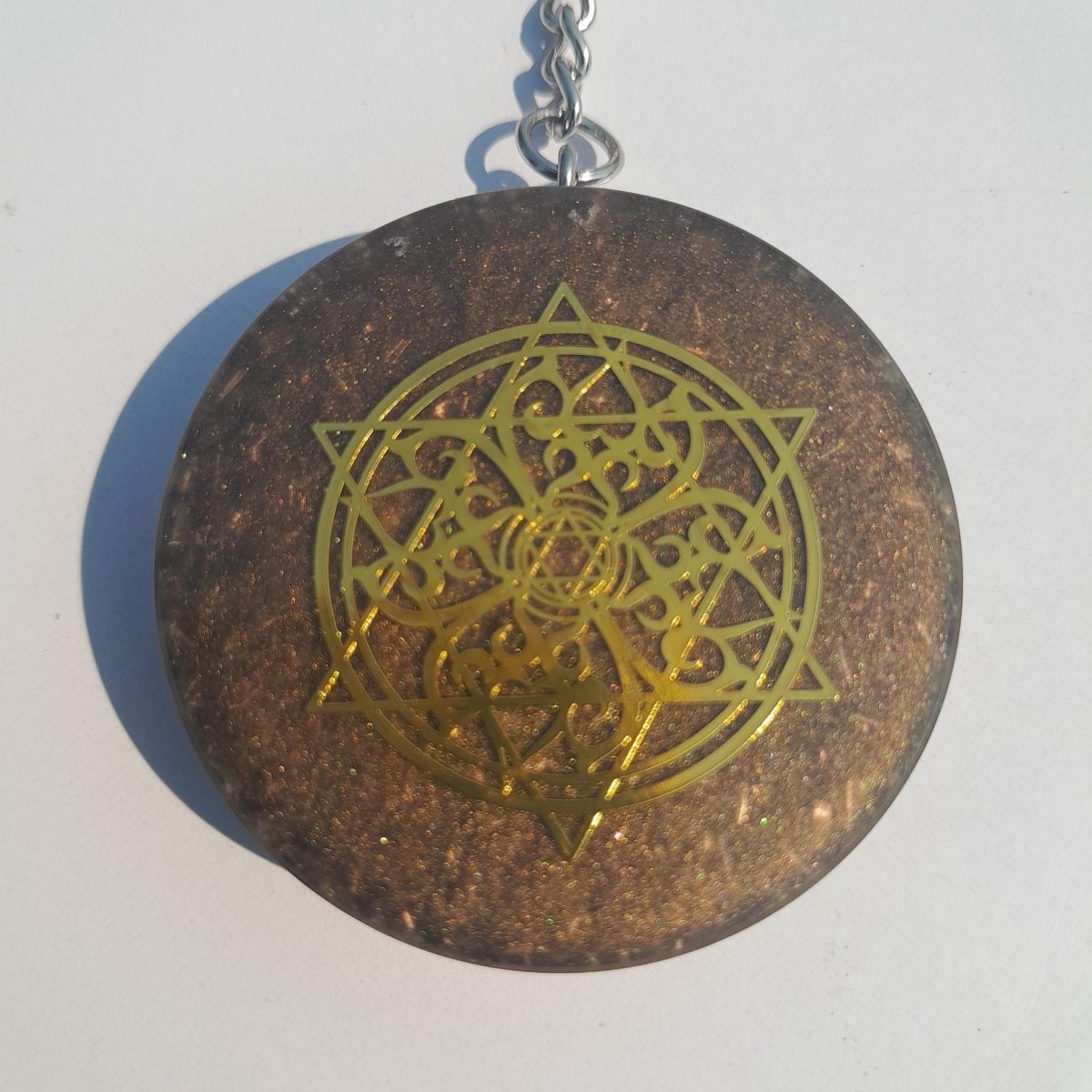 Llavero Orgonita Estrella de 6 Puntas Marrón con Shunguita - Mundo Orgon