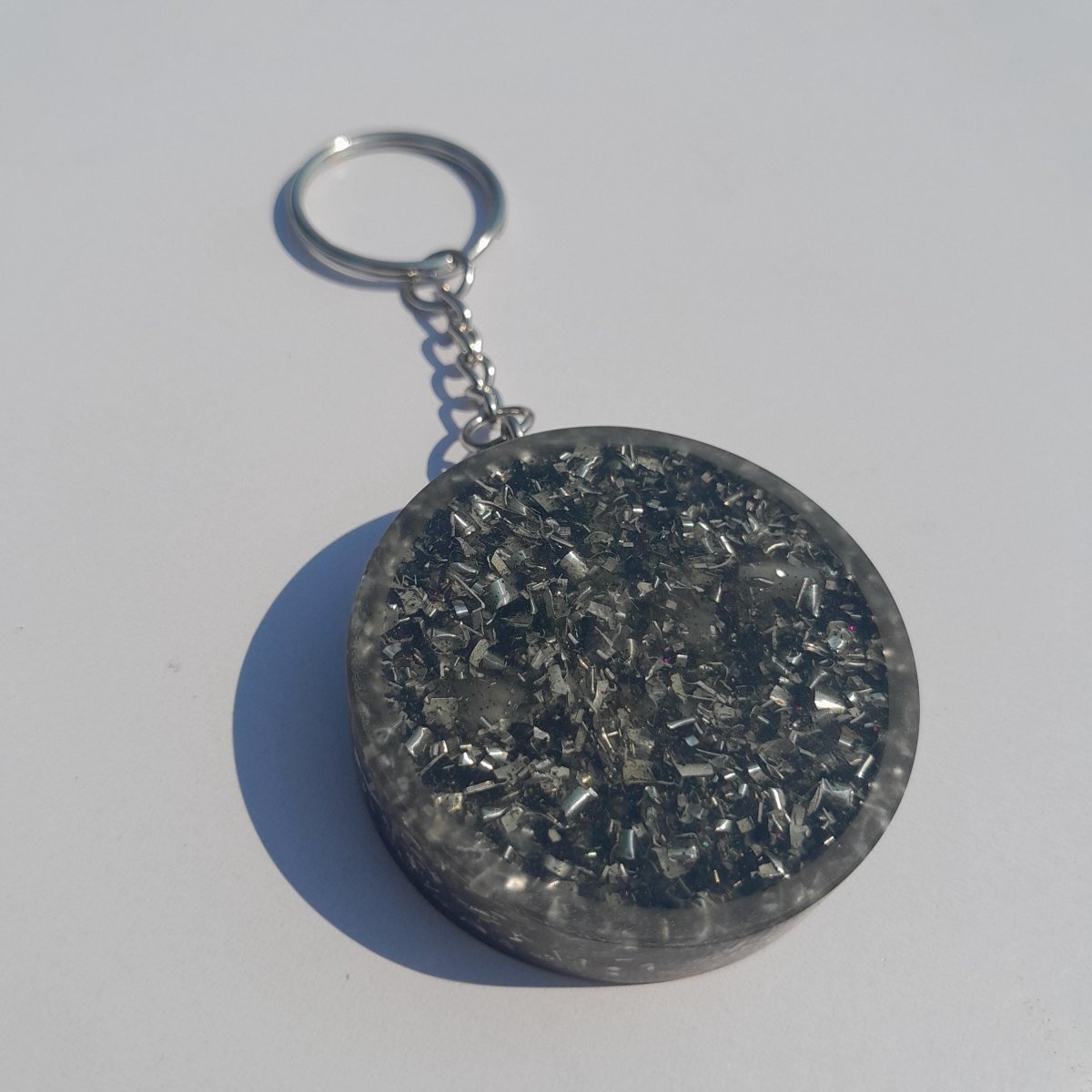 Llavero Orgonita Estrella de 6 Puntas Marrón con Shunguita - Mundo Orgon