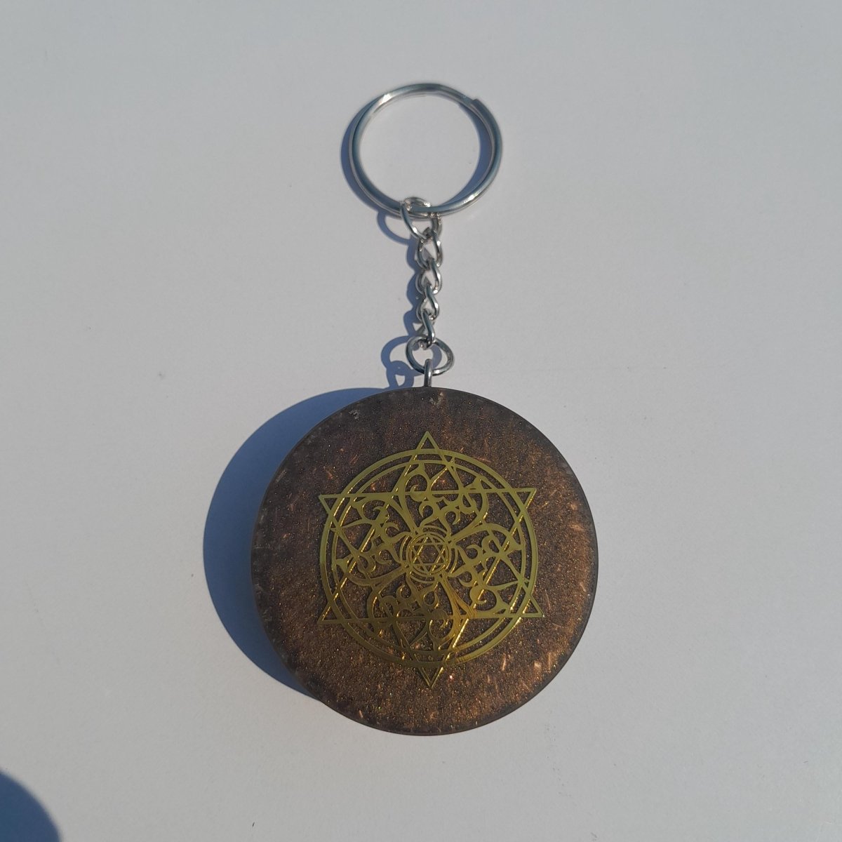 Llavero Orgonita Estrella de 6 Puntas Marrón con Shunguita - Mundo Orgon