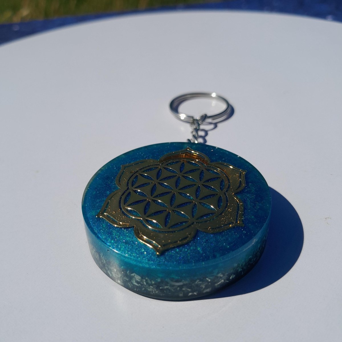 Llavero Orgonita Flor de la Vida con Flor de Loto Azul con Shunguita - Mundo Orgon